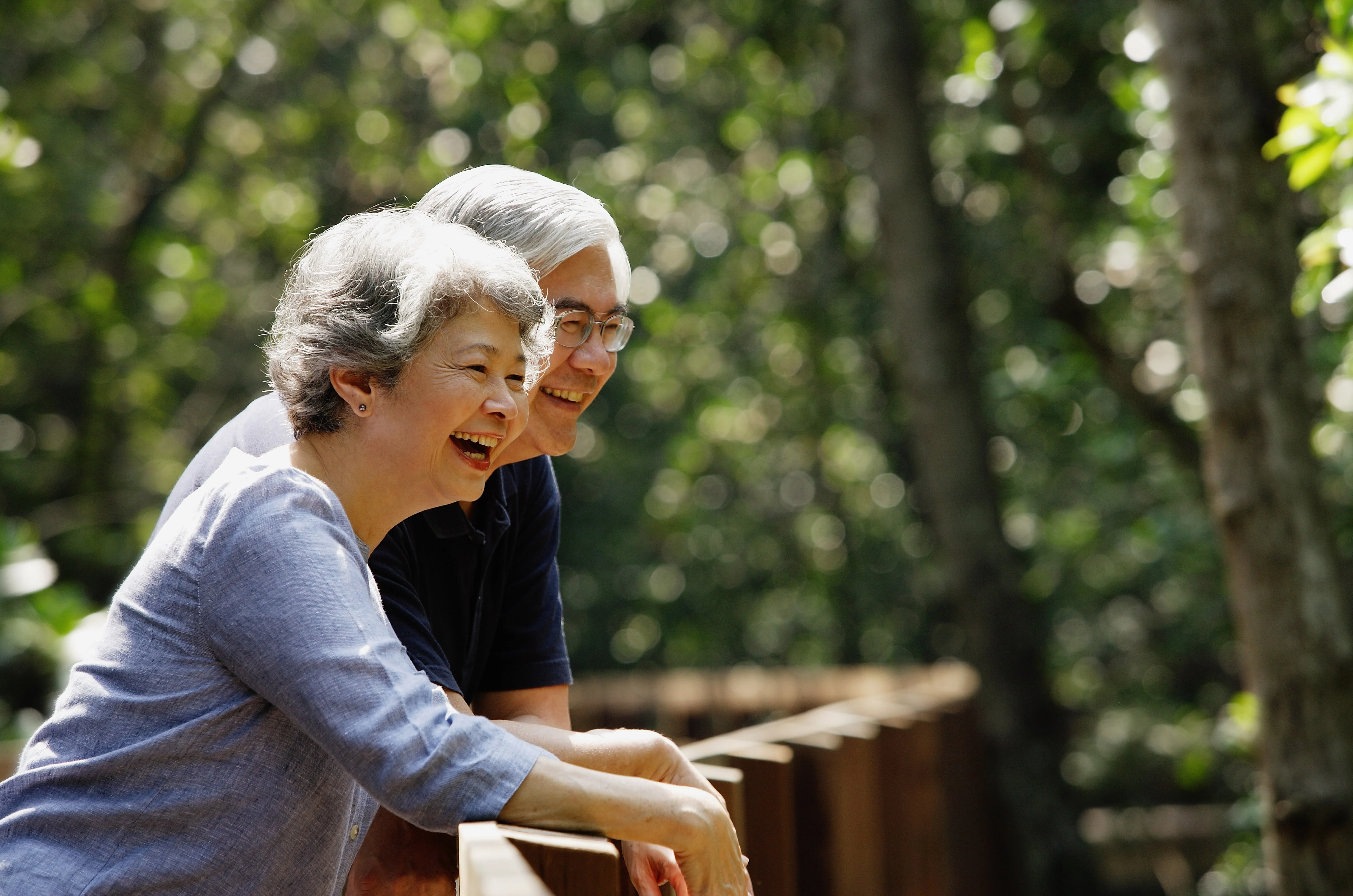 an older woman and an older woman embracing outdoors