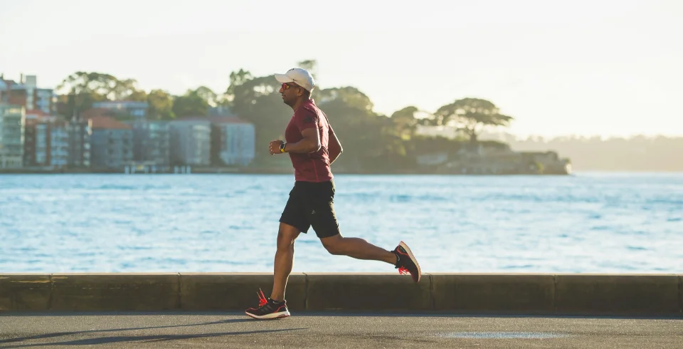 a man running on a concrete ledge