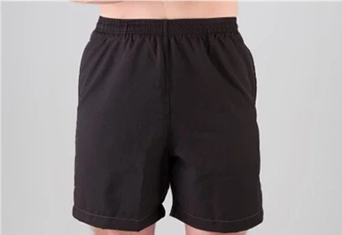 a person wearing black shorts